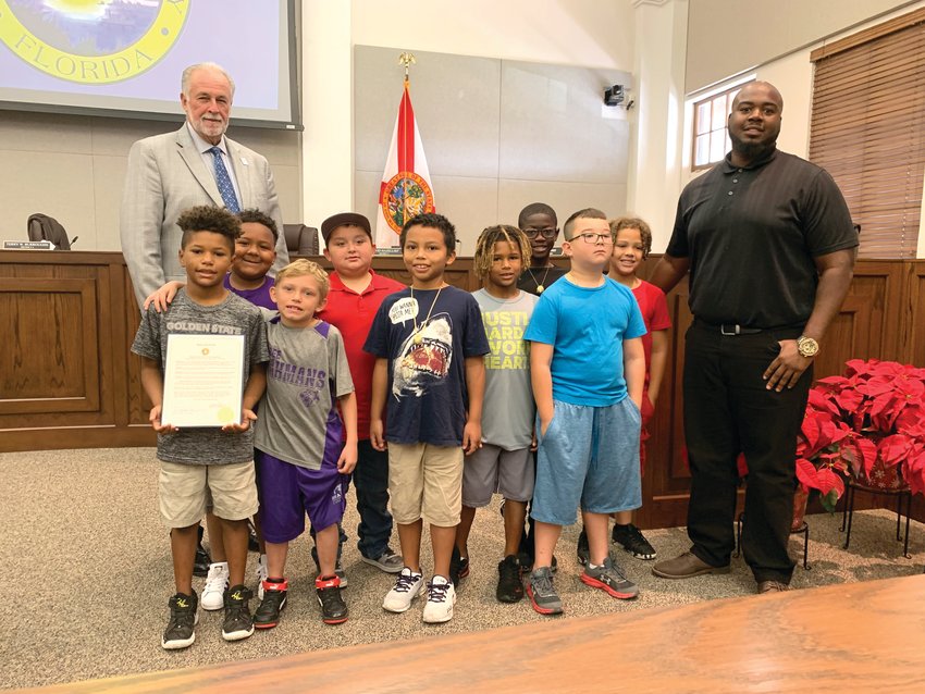 The Mighty Mites were honored by the Okeechobee County Commission on Dec. 2